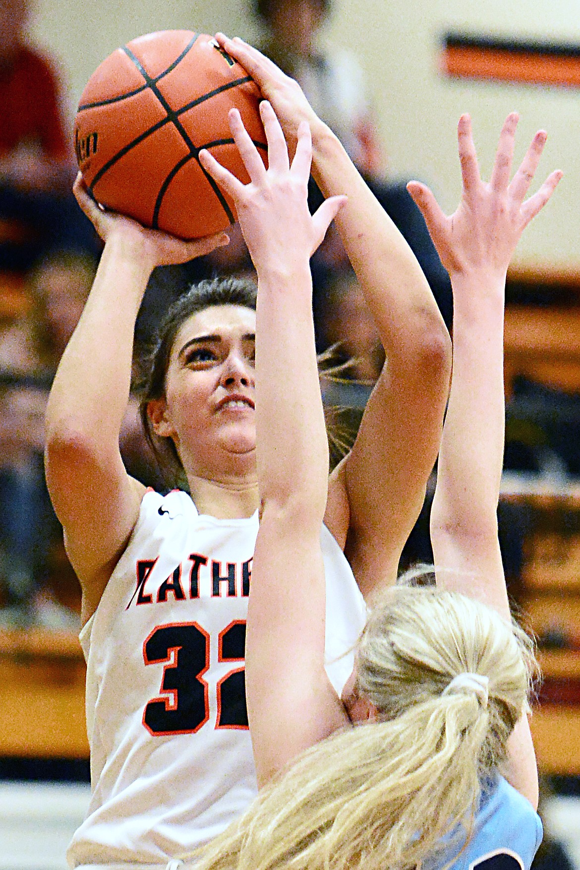 Flathead's Taylor Henley (32) shoots over Great Falls' Taylor VanderMars (42) in the first half at Flathead High School on Friday. (Casey Kreider/Daily Inter Lake)