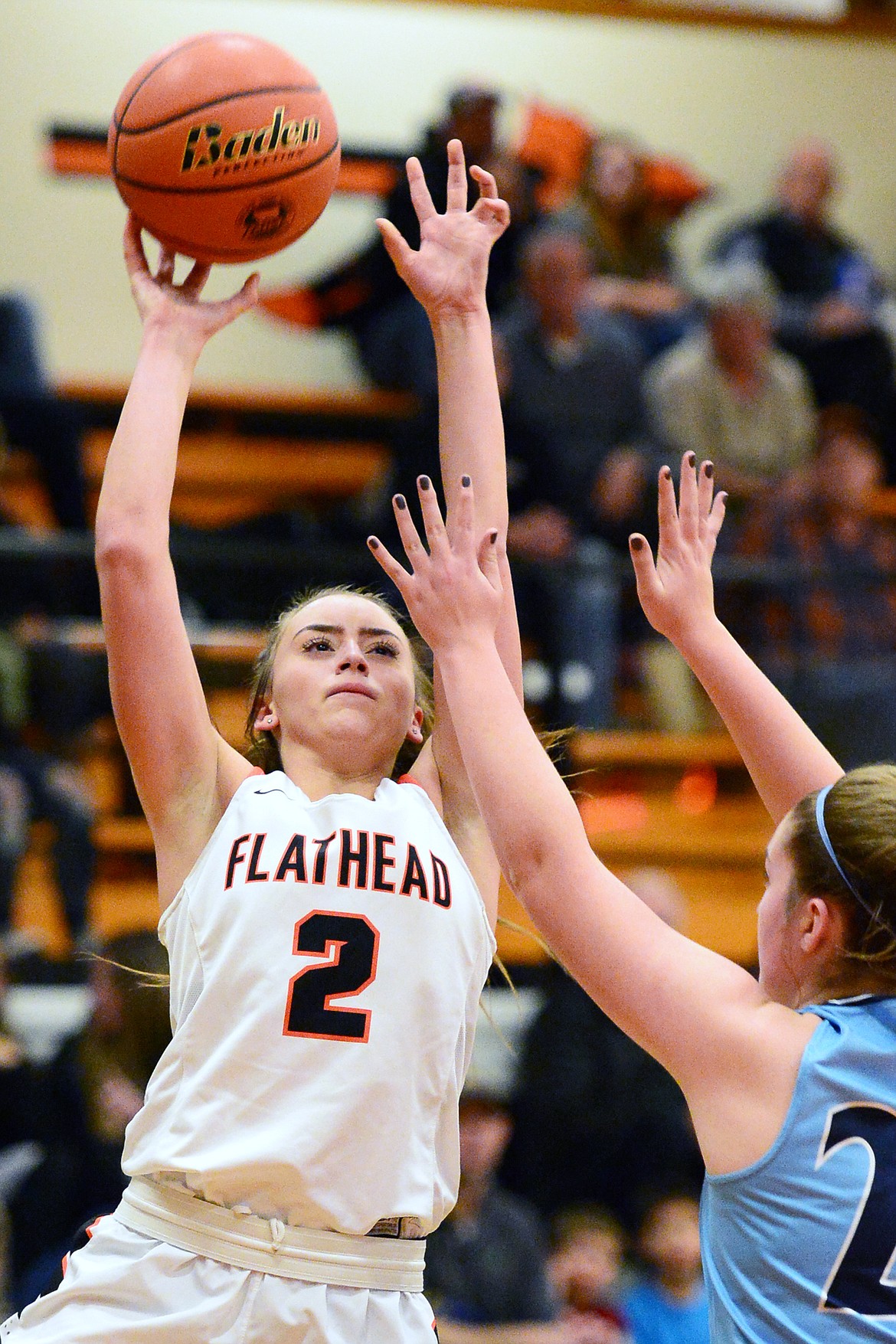 Flathead's Emily Lembke (2) shoots over Great Falls' Crisha Polk (20) in the first half at Flathead High School on Friday. (Casey Kreider/Daily Inter Lake)