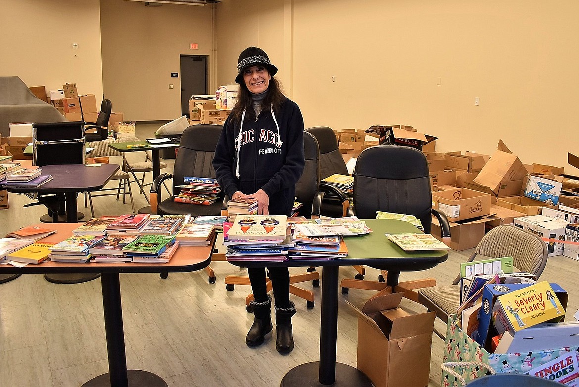Courtesy photo
Jingle Books volunteer Diana Gissel sorts donated books in a space at Riverstone.