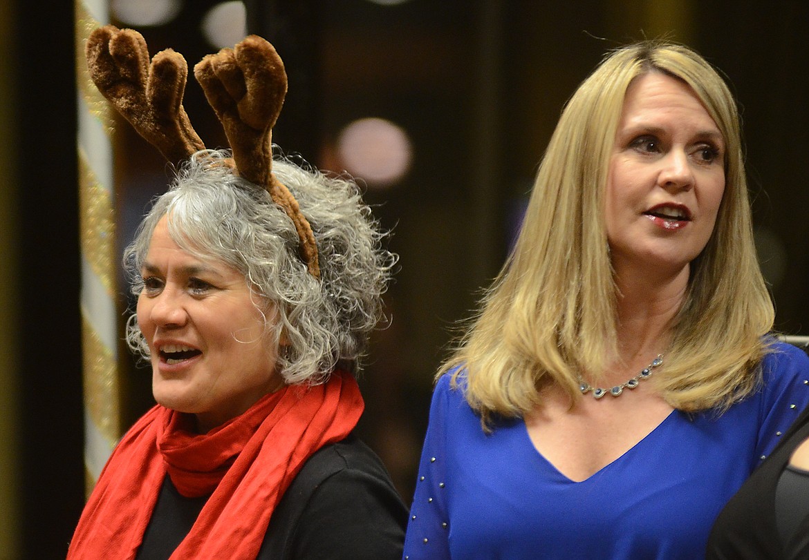 Donning antlers, attendees at the Evergreen Chamber banquent sing &#147;Rudolph.&#148;