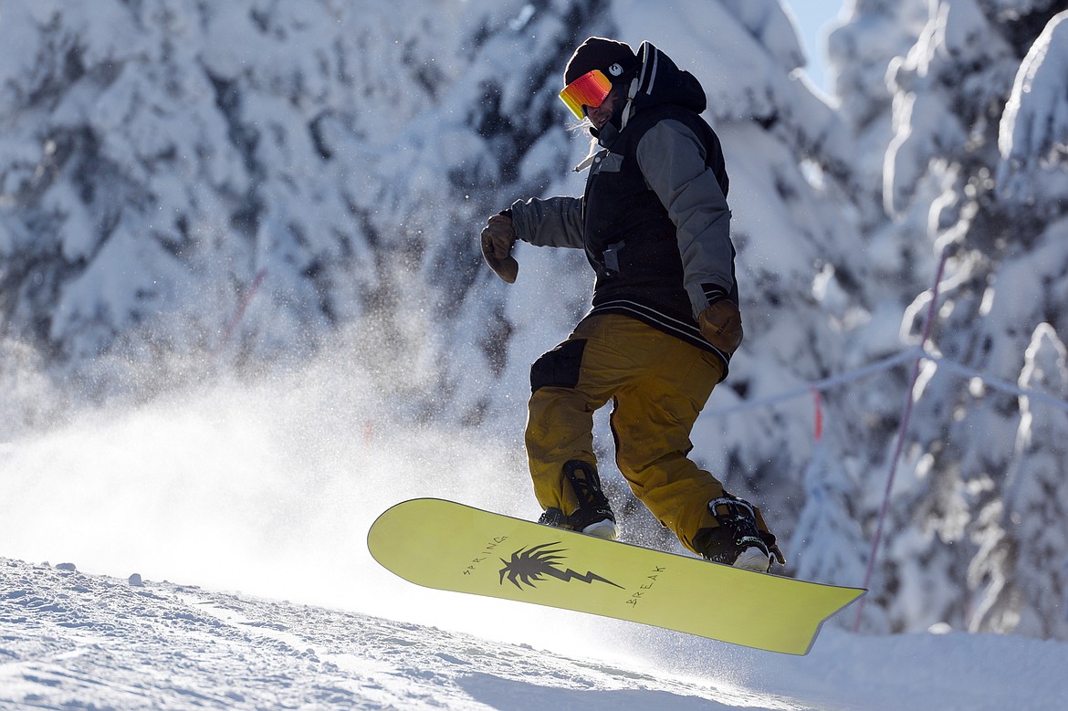 A snowboarder rides down a trail on opening day at Whitefish Mountain Resort on Thursday. (Casey Kreider/Daily Inter Lake)