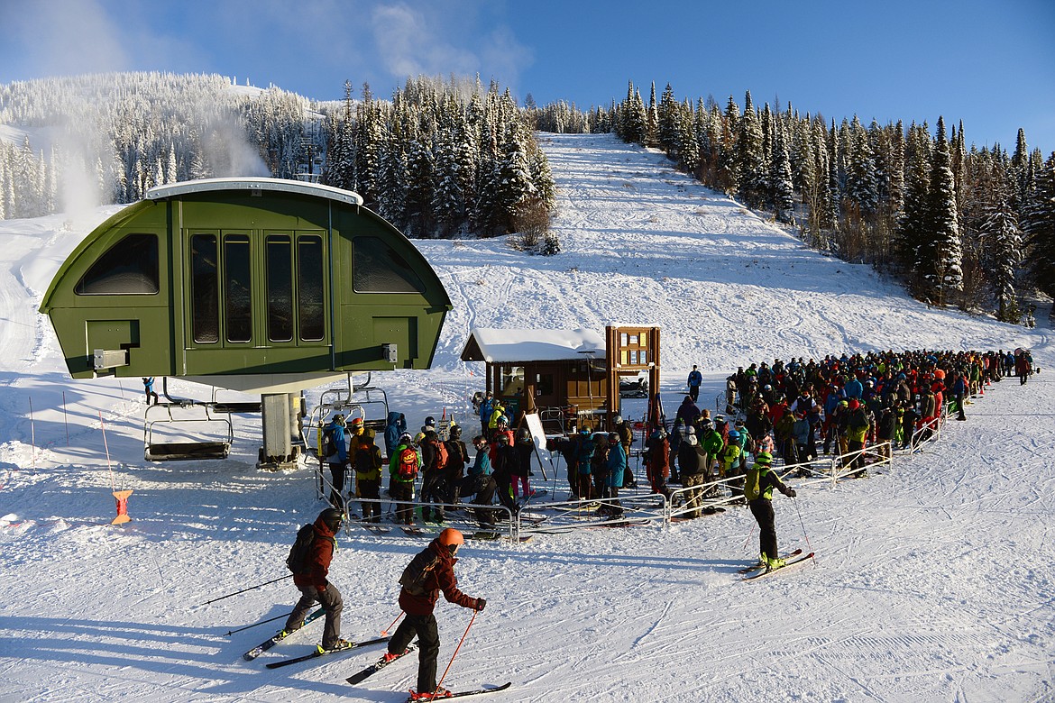 Skiers and snowboarders line up at Chair 1 before the start of opening day at Whitefish Mountain Resort on Thursday. (Casey Kreider/Daily Inter Lake)