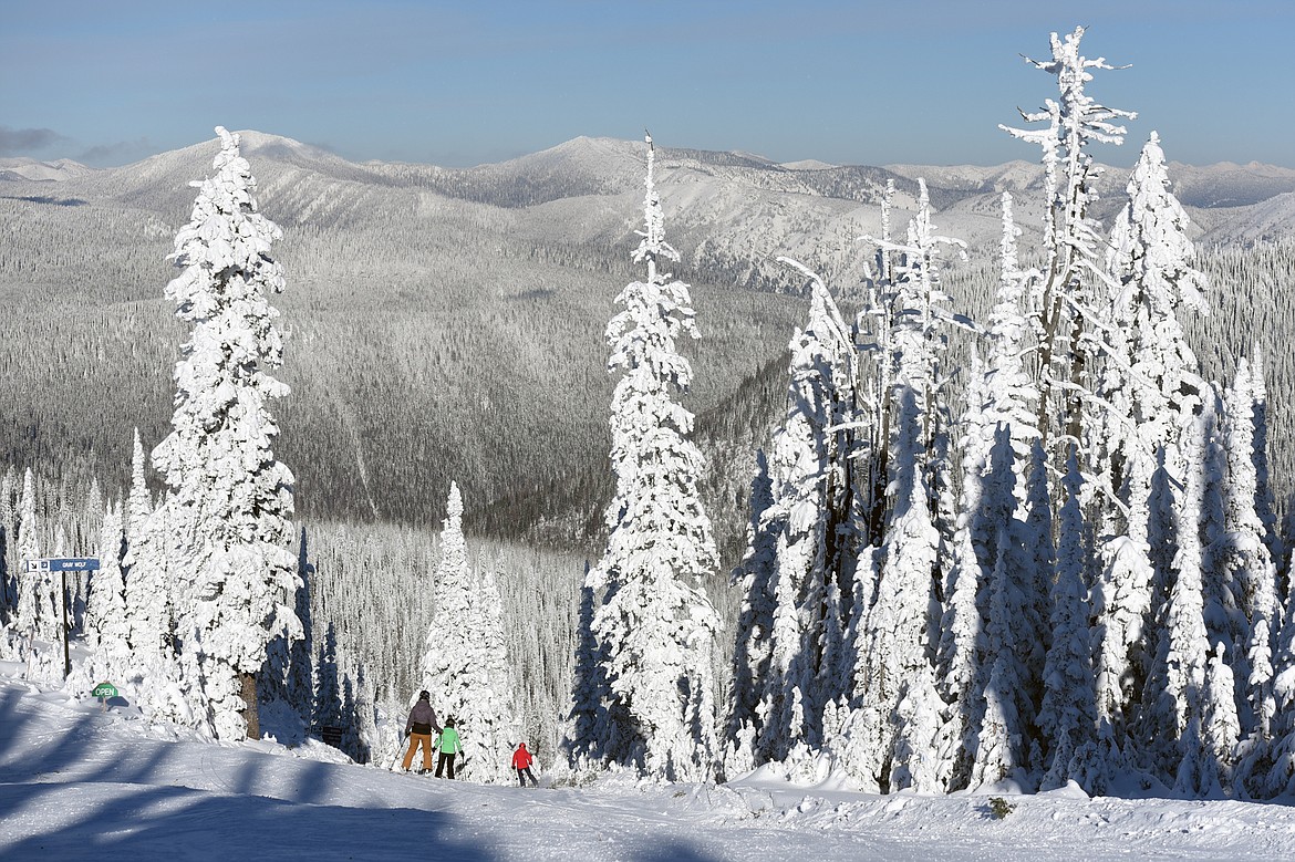 Skiers head down Gray Wolf on opening day at Whitefish Mountain Resort on Thursday. (Casey Kreider/Daily Inter Lake)