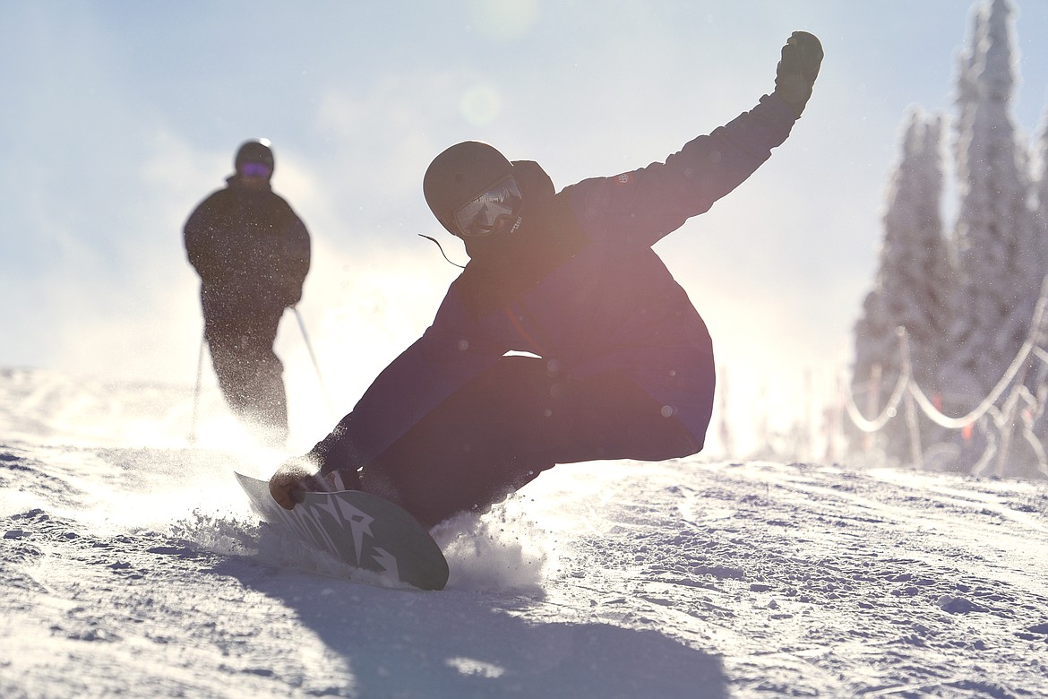 A snowboarder rides down a trail on opening day at Whitefish Mountain Resort on Thursday. (Casey Kreider/Daily Inter Lake)