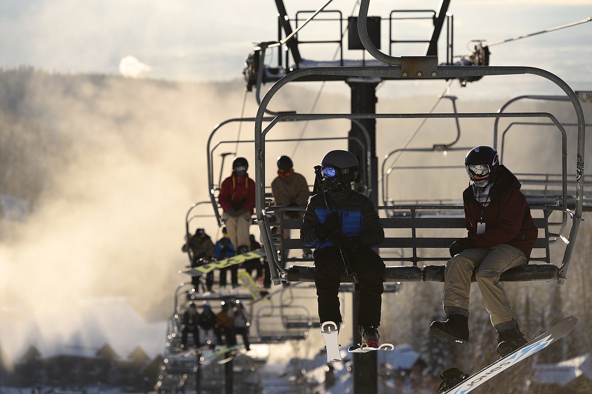 Skiers and snowboarders ride Chair 6 up to Chair 1 on opening day at Whitefish Mountain Resort on Thursday. (Casey Kreider/Daily Inter Lake)