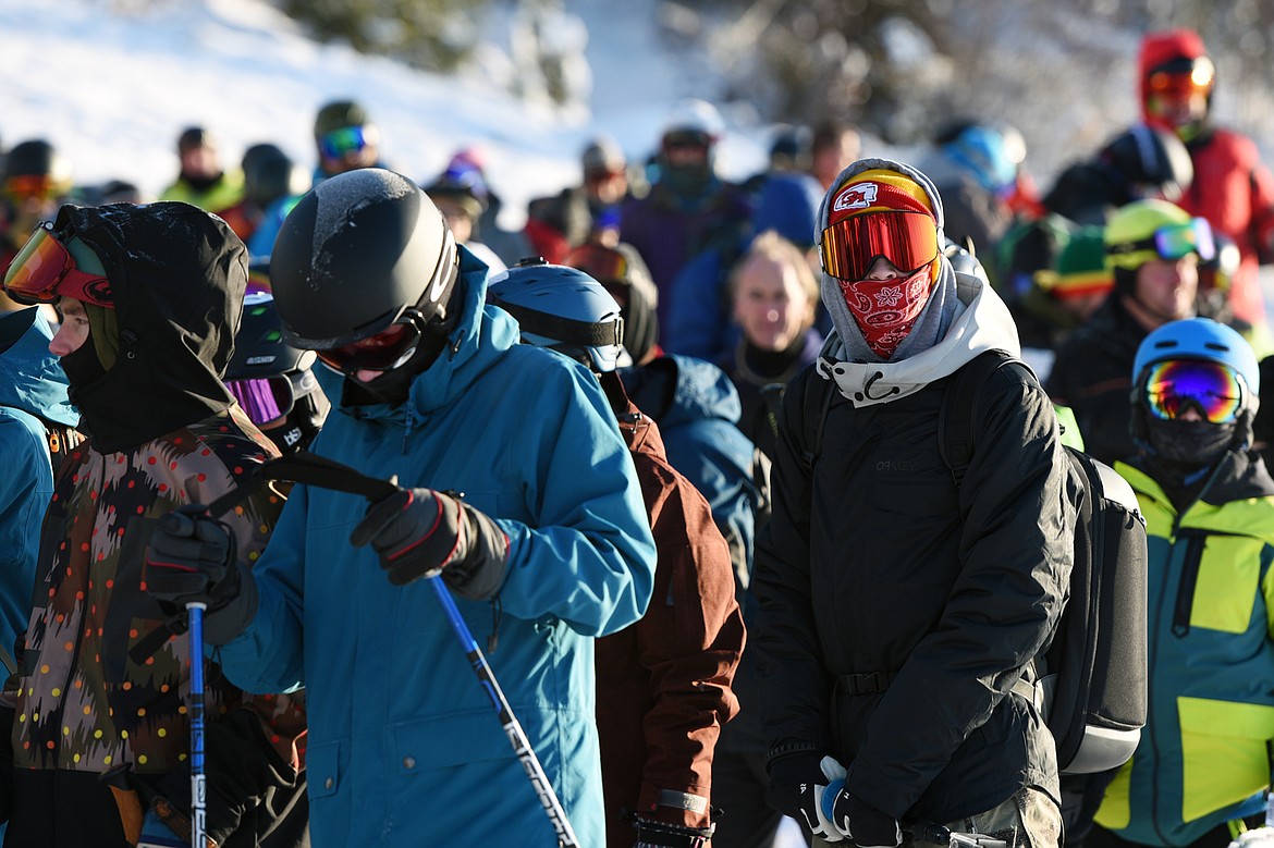 Skiers and snowboarders line up at Chair 1 before the start of opening day at Whitefish Mountain Resort on Thursday. (Casey Kreider/Daily Inter Lake)