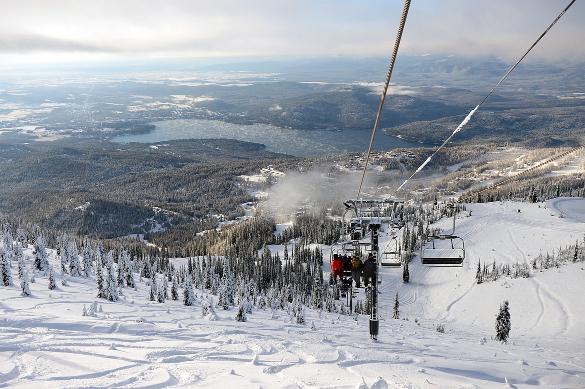 Skiers and snowboarders ride Chair 1 to the summit on opening day at Whitefish Mountain Resort on Thursday. (Casey Kreider/Daily Inter Lake)