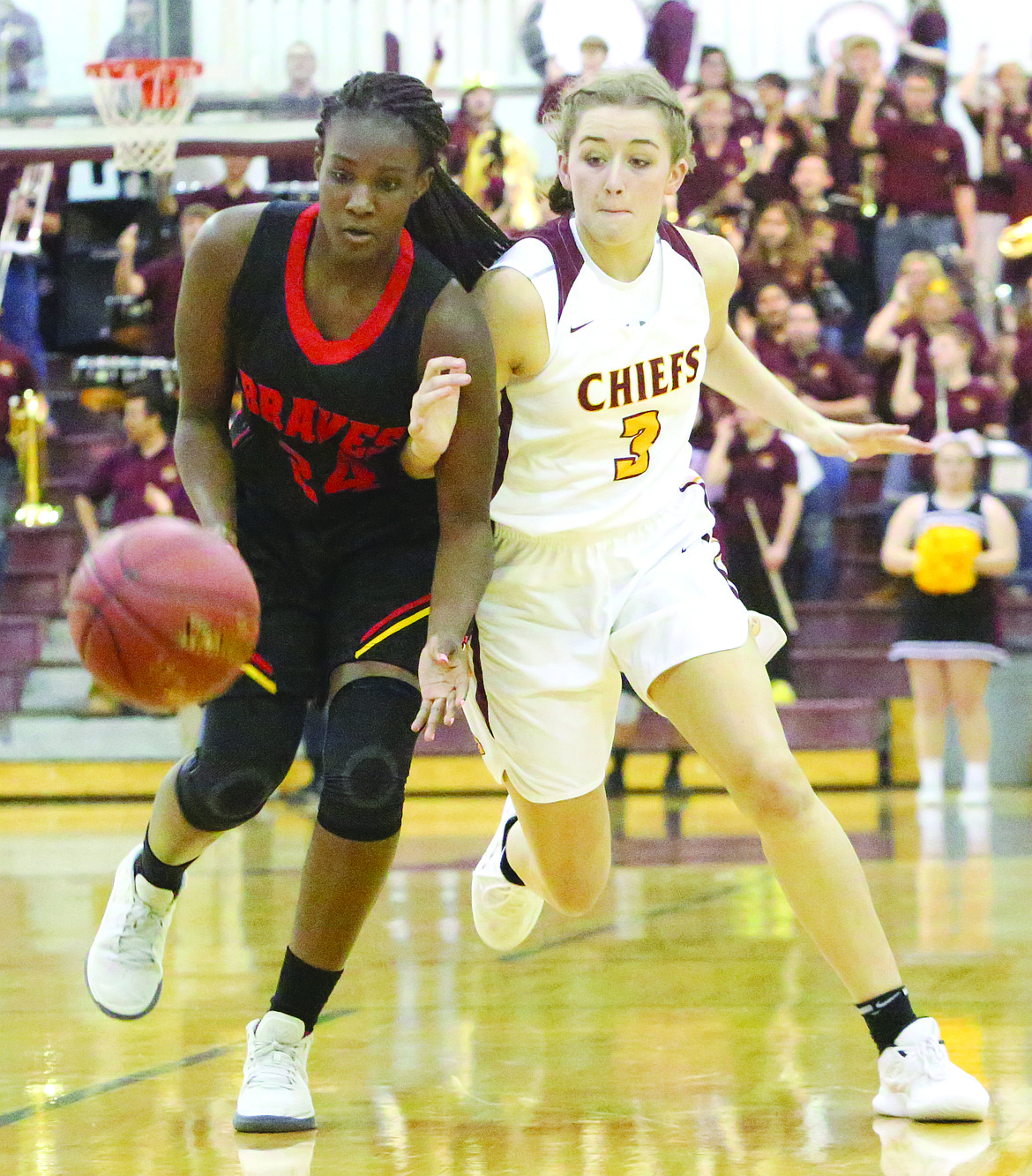 Connor Vanderweyst/Columbia Basin Herald
Moses Lake's Brecka Erdmann (right) and Kamiakin's Oumou Toure chase after a loose ball.