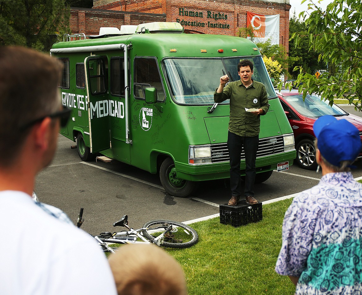 LOREN BENOIT/Press file
Luke Mayville, who helped initiate Reclaim Idaho, speaks to about 30 people who turned out to meet the Reclaim Idaho &#147;Medicaid Express&#148; when it stopped at the Human Rights Education Institute in July.