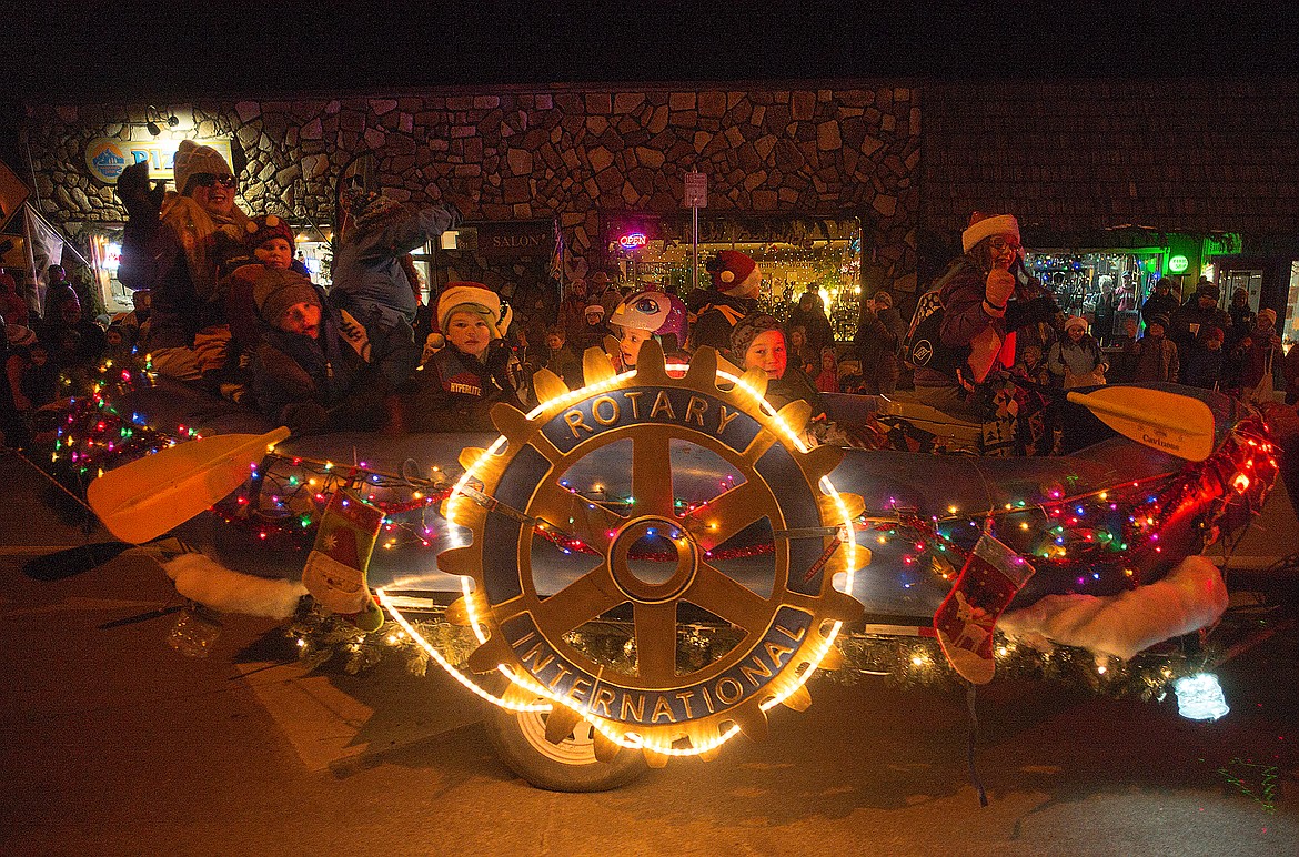 Paddling through the parade on the Rotary float.