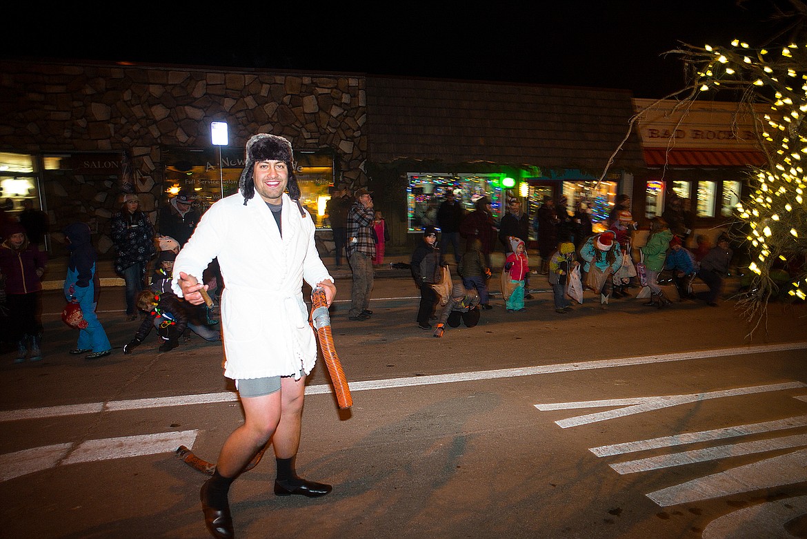 A reveler walks in the parade.