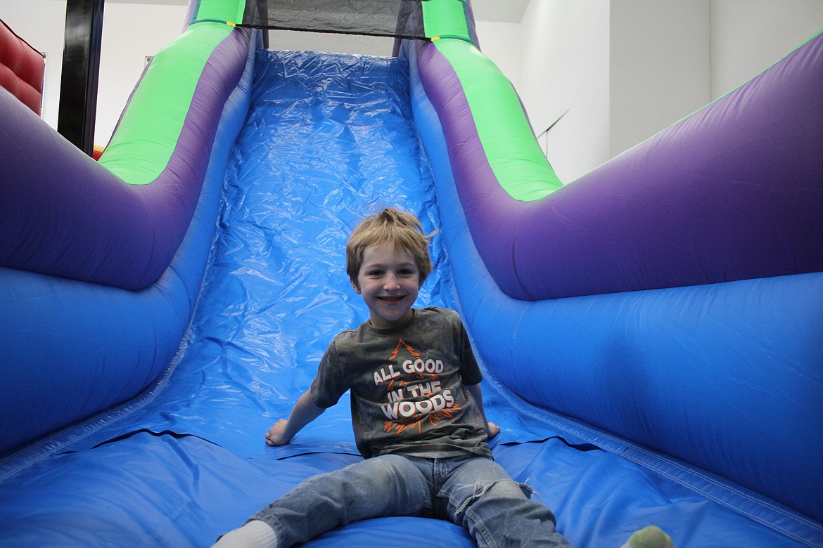 Photos by TANNA YEOUMANS
Oliver Gibbins tries one of the slides at the House of Bounce, which will open Friday in Bonners Ferry.