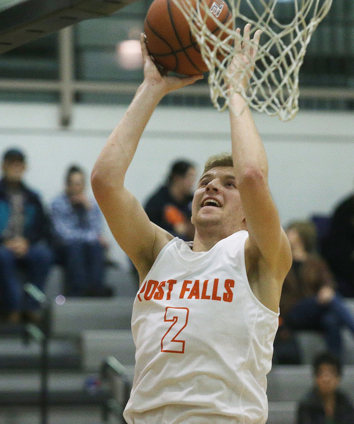 Post Falls guard Colby Gennett goes for a layup in Friday night's game against Rogers at Post Falls High School. (LOREN BENOIT/Press)