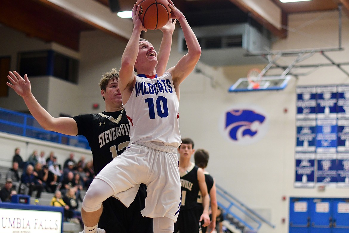 Dillon Wanner goes up for a tough shot in the fourth quarter against Stevenville Saturday. Wanner scored 10 points as the Wildcats defeated the Yellowjackets, 58-50. (Jeremy Weber photo)