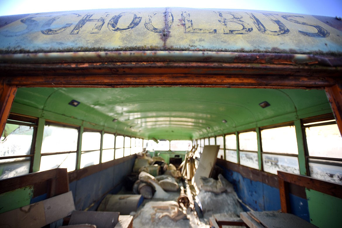 An old school bus sits on the property of Wisher&#146;s Auto Recycling.