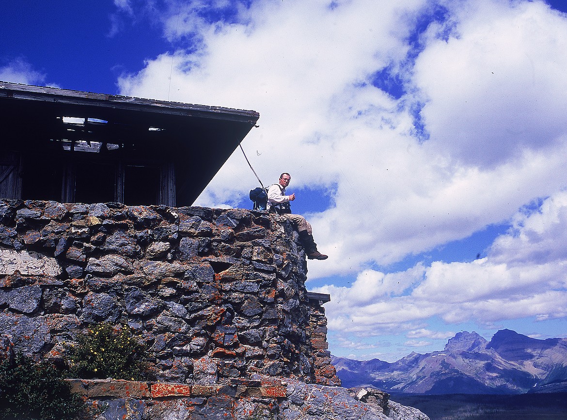 Corwyn Wyman sits on the edge of the Heaven&#146;s Peak Lookout a few years before it was restored by Polzin, his crews and volunteers.