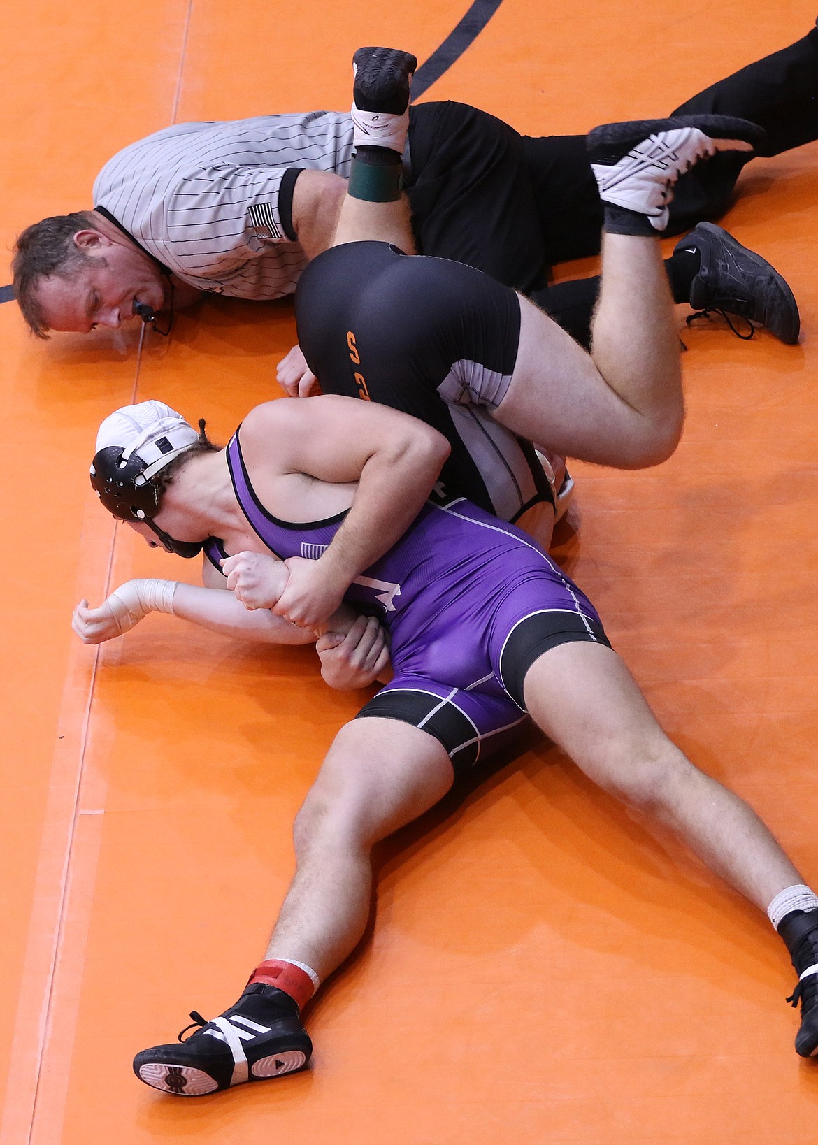 Hunter Fritsch of Polson captured the 170-pound title at the Owen Invite last weekend at Salish Kootenai College in Pablo. Above, Fritsch pins Canyon Shope of Frenchtown in the semifinals, with 4 seconds to go in the second period. (Bob Gunderson/Lake County Leader)