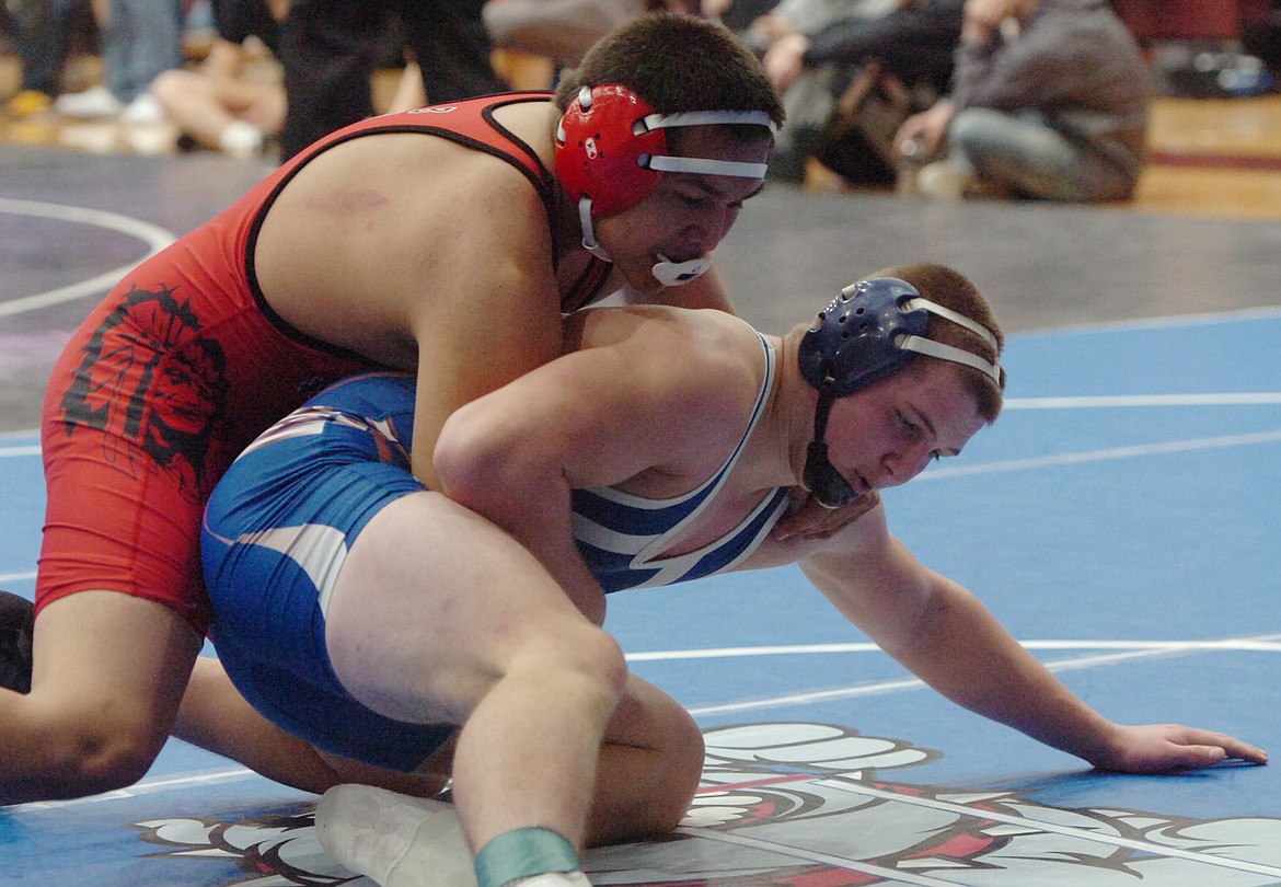 Clark Fork Mountain Cat Trey Green, in blue, hit the mat with Ryan Running Crane from Browning. Green placed third in the 182-pound class at the Owen Invitational held at Salish Kootenai College last weekend. (Joe Sova photos/Mineral Independent)