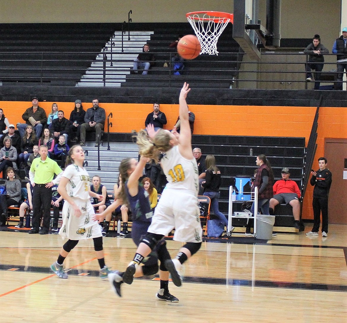 St. Regis Lady Tiger Emma Hill makes a basket against Valley Christian during the Tip-Off Tournament on Nov. 30. The Lady Tigers won that game, 57-31.