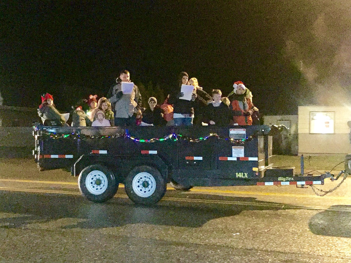 Photo by SAM WOODY/ 
A float filled with carolers cruises through Osburn during last year&#146;s Christmas parade.