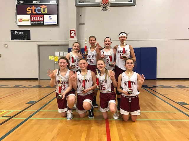 Courtesy photo
The North Idaho Elite seventh-grade girls basketball team won its fourth straight tournament, capturing the Spokane AAU Santa Slammer for the fourth straight year. In the front row from left are Payton Sterling, Sophia Zufelt, Brooklyn Brennan and Lauren Bengtson; and back row from left, Taylor Hill, Avery Waddington, Kamryn Pickford and Kurtsten McKellips.