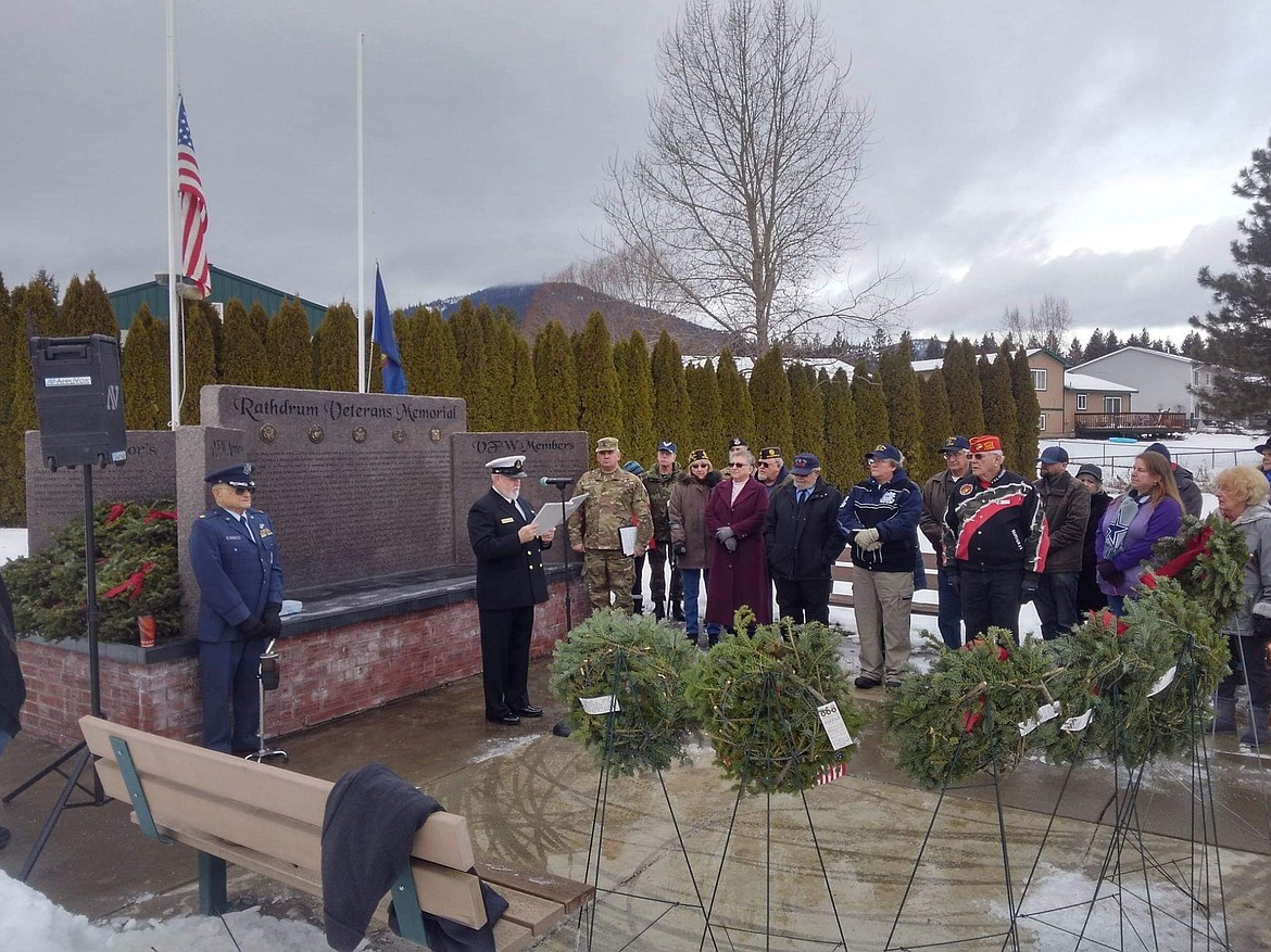 Courtesy photo
U.S. Navy veteran Frank Bega addresses the crowd at the Wreaths Across ceremony on Saturday at Pinegrove Cemetery in Rathdrum. Leroy Kronvall is in the blue suit on the left.