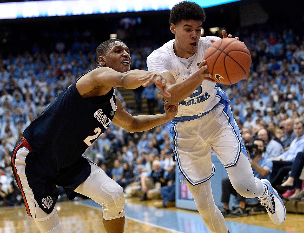 North Carolina's Cameron Johnson, right, battles Gonzaga's Jeremy Jones (22) for a loose ball during the second half at the Dean Smith Center on Saturday, Dec. 15, 2018, in Chapel Hill, N.C. North Carolina won, 103-90. **FOR USE WITH THIS STORY ONLY** (Grant Halverson/Getty Images/TNS)