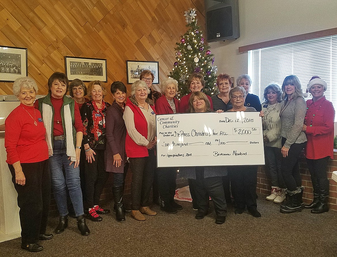 HOLLY PASZCZYNSKA/PRESS
On Dec. 12, the 3Cs (Cancer and Community Charities) presented a check in the amount of $2,000 for the Press Christmas for All program. Pictured here (from left) are 3Cs members Judy Gardner, Lisa Thomas, Peggy Leupp, Sally Barnett, Sherry Beno, Doris Sadler, Connie Anderson, Lucille Smith, Marilyn Smith, Sandie Rolphe, Mary Ann Herston, Phyllis Mixon, Rhonda Newton, Barbara Newland. In front holding the check are CDA Press City Editor, Maureen Dolan and Carolyn Anderson, 3Cs.