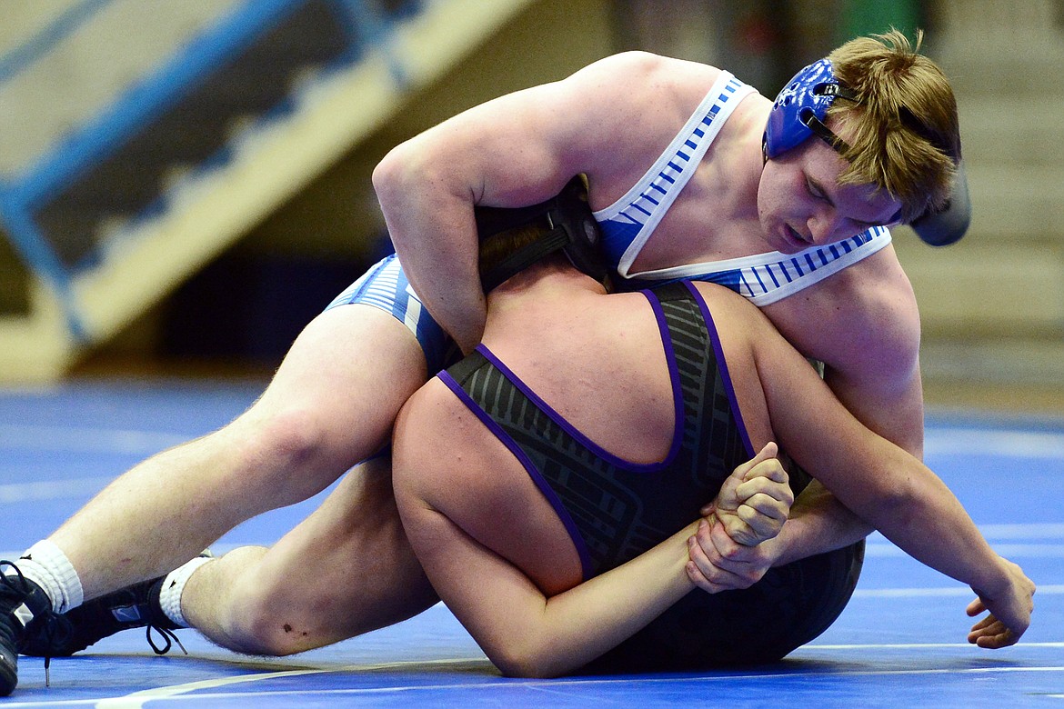 Columbia Falls' Colton McPhee works toward a pin of Polson's Justice Moore at 205 lbs. at Columbia Falls High School on Tuesday. (Casey Kreider/Daily Inter Lake)