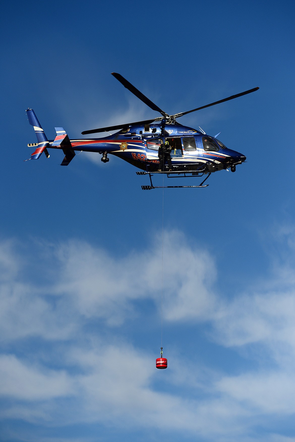 Flathead County Sheriff Chuck Curry deploys the RECCO Helicopter Detector during a training exercise with Two Bear Air Rescue on Friday, Dec. 14. RECCO technology allows rescuers to search and scan large areas from the air to locate missing persons equipped with RECCO reflectors. (Casey Kreider/Daily Inter Lake)