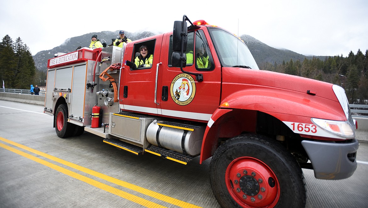 Members of the Martin City Volunteer Fire Department were among the first to cross the new $12.7 million U.S. Highway 2 bridge following the South Fork Bridge Ribbon-Cutting on Tuesday, December 18, in Hungry Horse.(Brenda Ahearn/Daily Inter Lake)