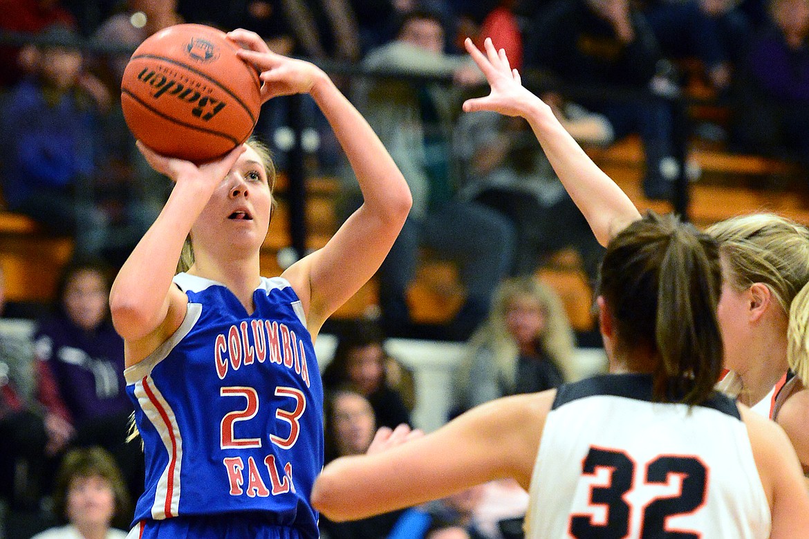 Columbia Falls&#146; Ryley Kehr (23) hits a three against Flathead at Flathead High School on Saturday. (Casey Kreider/Daily Inter Lake)