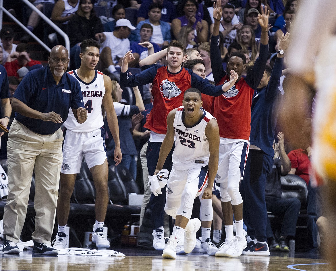 Gonzaga's bench reacts after a comeback against Tennessee during the first half of an NCAA college basketball game Sunday, Dec. 9, 2018, in Phoenix. (AP Photo/Darryl Webb)