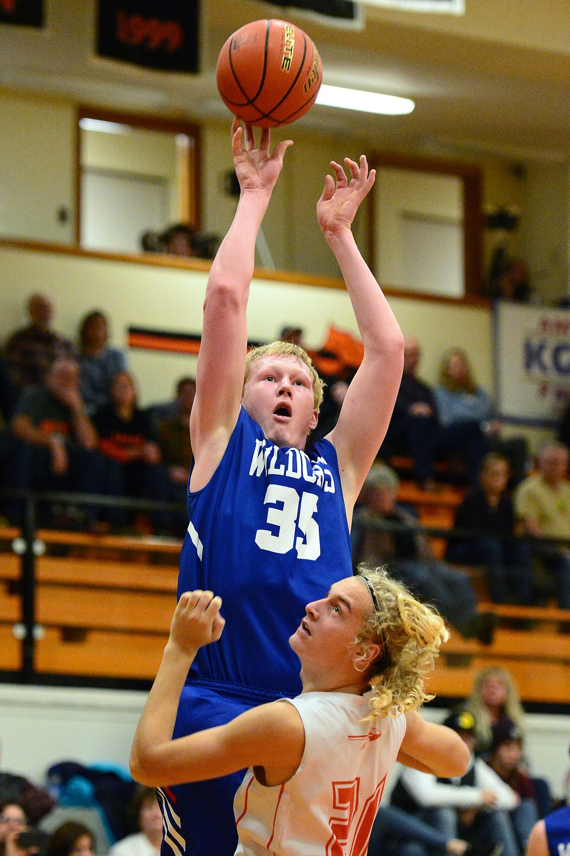 Columbia Falls' Sam Hovde (35) shoots over Flathead's Ethan Vandenbosch (21) at Flathead High School on Saturday. (Casey Kreider/Daily Inter Lake)