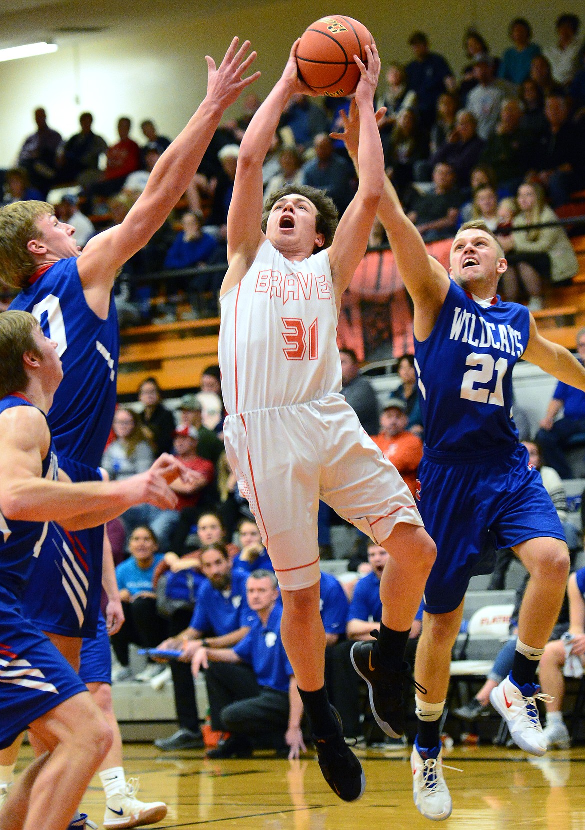 Flathead's Brett Thompson (31) drives to the hoop against Columbia Falls at Flathead High School on Saturday. (Casey Kreider/Daily Inter Lake)