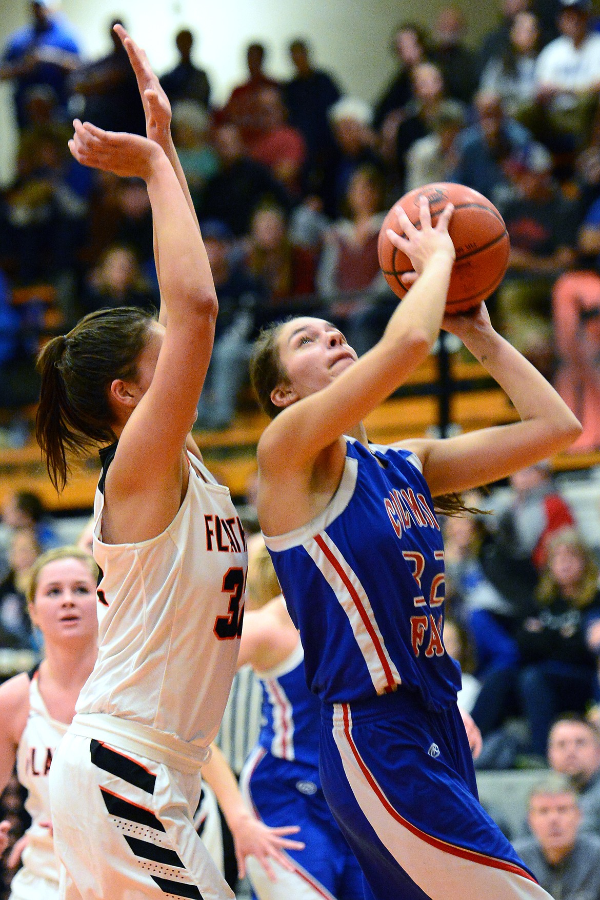 Columbia Falls' Madysen Hoerner (32) looks to shoot against Flathead's Taylor Henley (32) at Flathead High School on Saturday. (Casey Kreider/Daily Inter Lake)