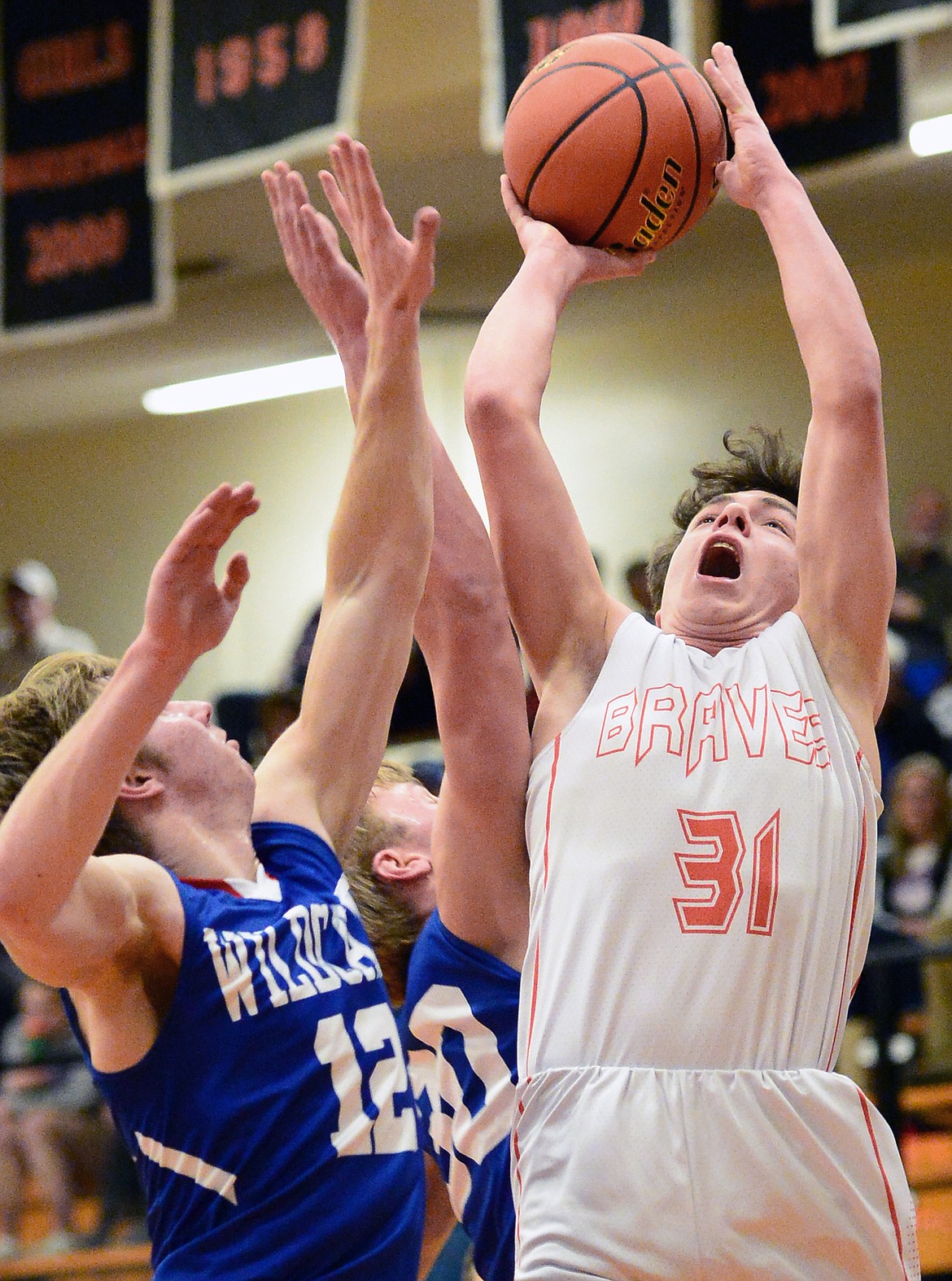 Flathead's Brett Thompson (31) drives to the hoop against Columbia Falls at Flathead High School on Saturday. (Casey Kreider/Daily Inter Lake)