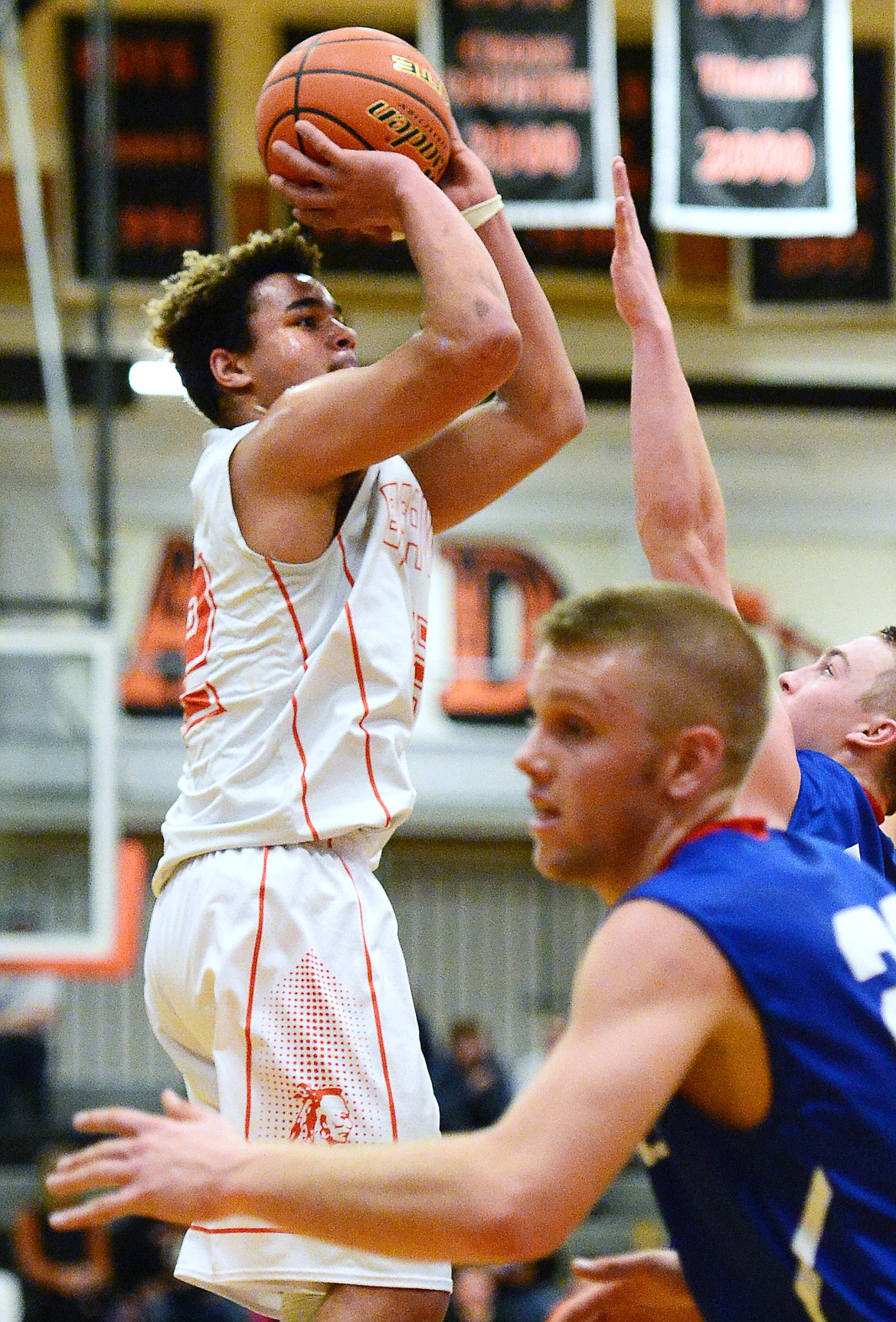 Flathead's Anthony Jones (42) looks to shoot in the first half against Columbia Falls at Flathead High School on Saturday. (Casey Kreider/Daily Inter Lake)