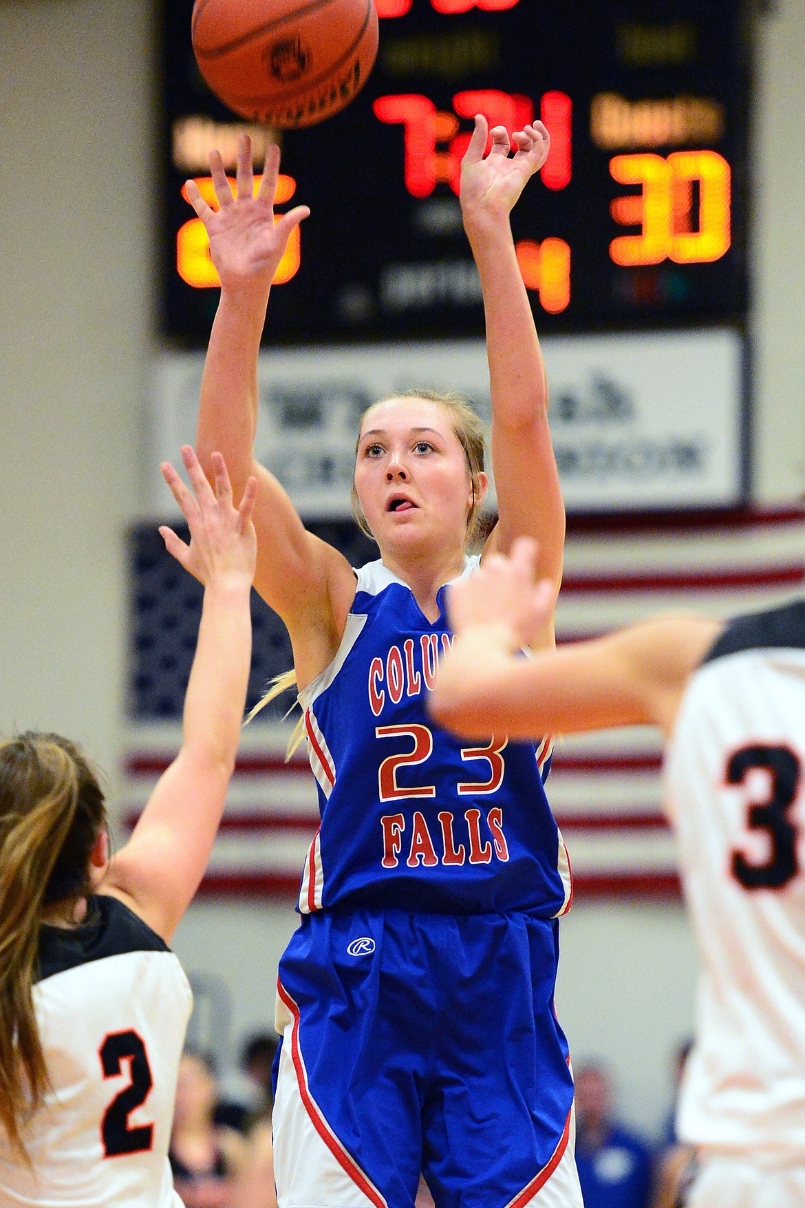 Columbia Falls' Ryley Kehr (23) hits a three at the top of the key against Flathead at Flathead High School on Saturday. (Casey Kreider/Daily Inter Lake)