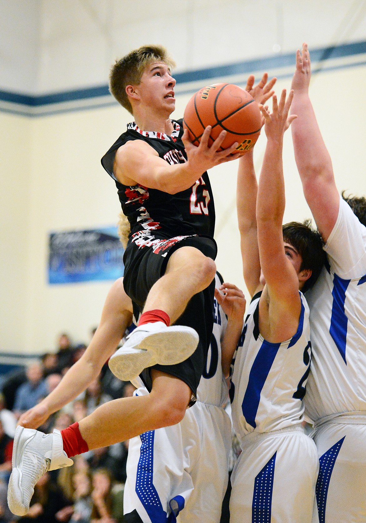 Flathead Valley Homeschool's Jordan Wininger (23) drives to the hoop for a layup against Stillwater Christian at Stillwater Christian School on Friday. (Casey Kreider/Daily Inter Lake)