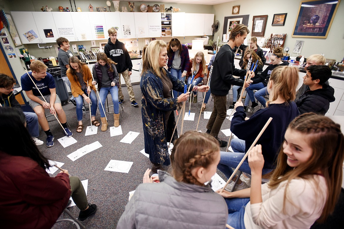 A class of freshman and sophomores participate in an exercise called &#147;penning the nose on Picasso&#148; before getting down to their serious lesson in Barb Beckwith&#146;s art class at Stillwater Christian School.
(Brenda Ahearn/Daily Inter Lake)