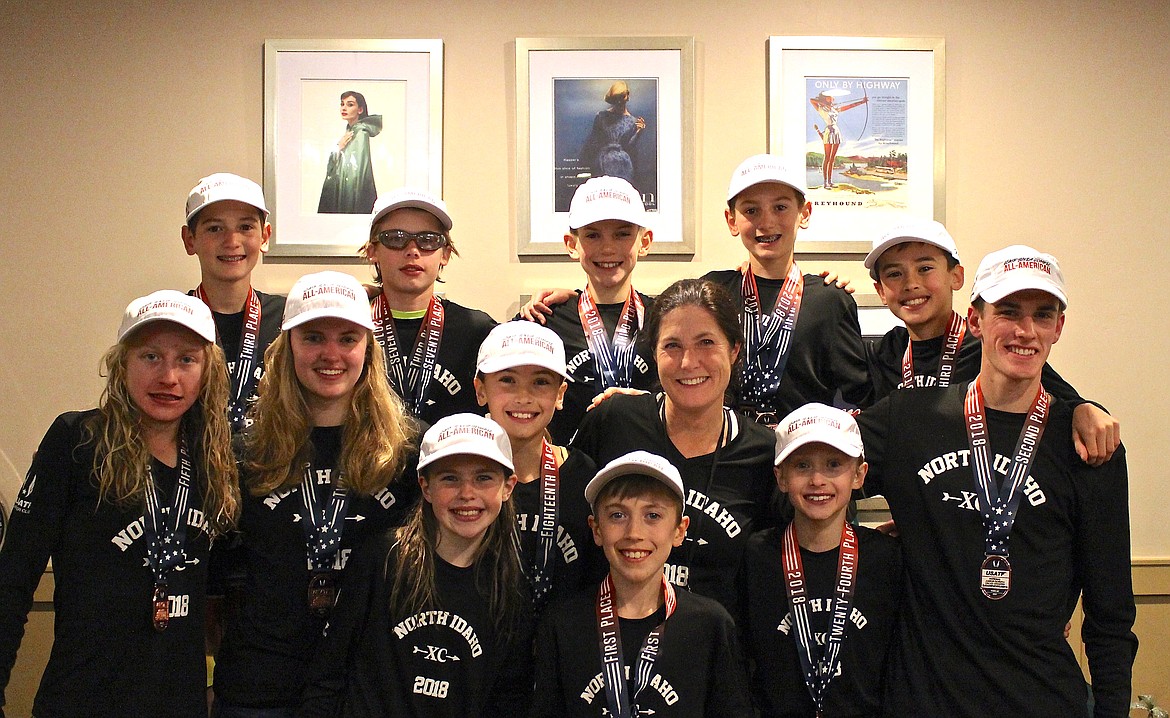 Courtesy photo
North Idaho Cross Country All-Americans from Saturday&#146;s USA Track and Field Jr. Olympic National Cross Country Championship in Reno are, front row from left, Helen Oyler, Rowan Henry and Adalyn Depew; second row from left, Lauren Forster, Dorothy Gallus, Elli Rietze, coach Erin Lydon Hart and Christian Kuplack; and back row from left, Zack Cervi-Skinner, Neil McCarthy, Lachlan May, Max Cervi-Skinner and Mitchell Rietze.