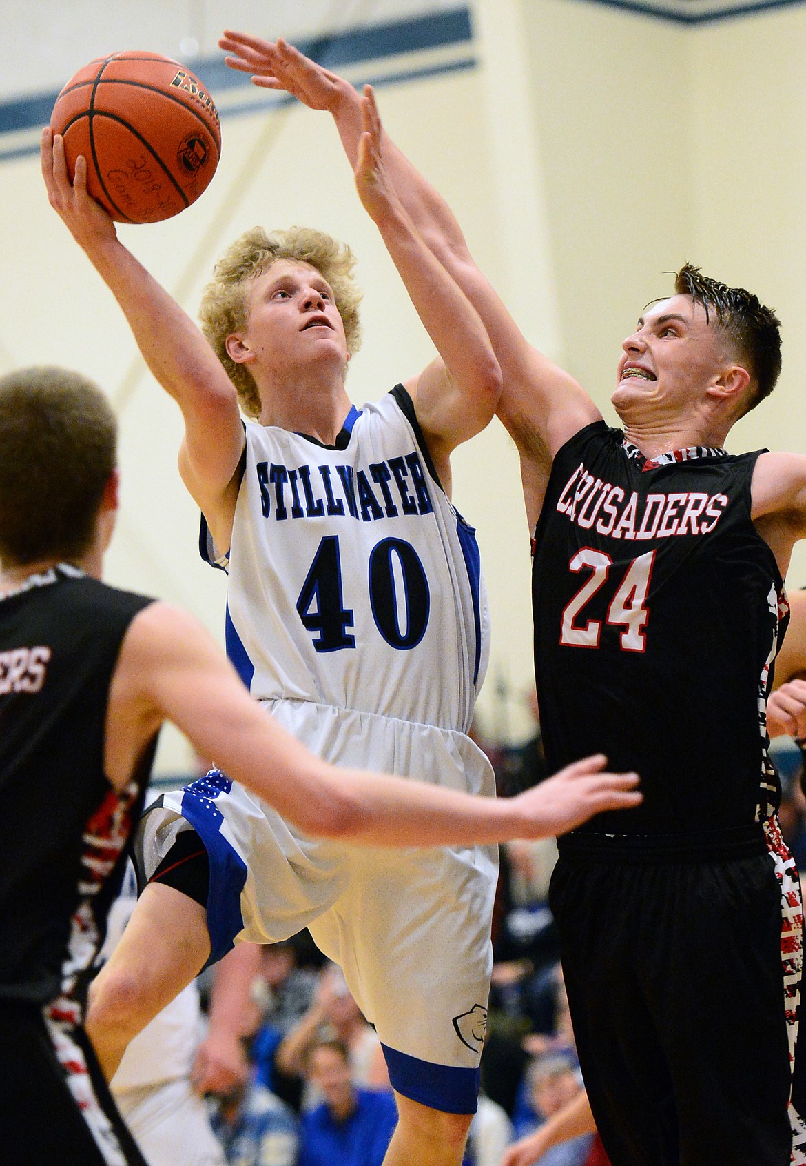 Stillwater Christian's Connor Drish (40) looks to shoot with Flathead Valley Homeschool's Spencer Burden (24) defending at Stillwater Christian School on Friday. (Casey Kreider/Daily Inter Lake)