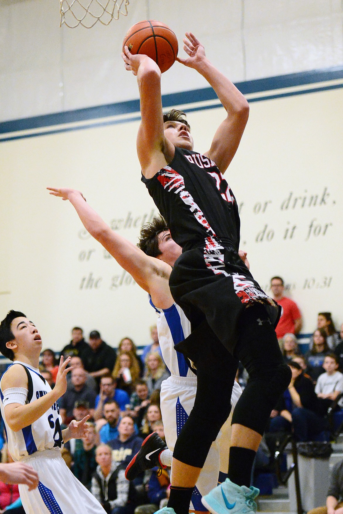 Flathead Valley Homeschool's Bubba Loyda (22) drives to the hoop for a layup against Stillwater Christian at Stillwater Christian School on Friday. (Casey Kreider/Daily Inter Lake)