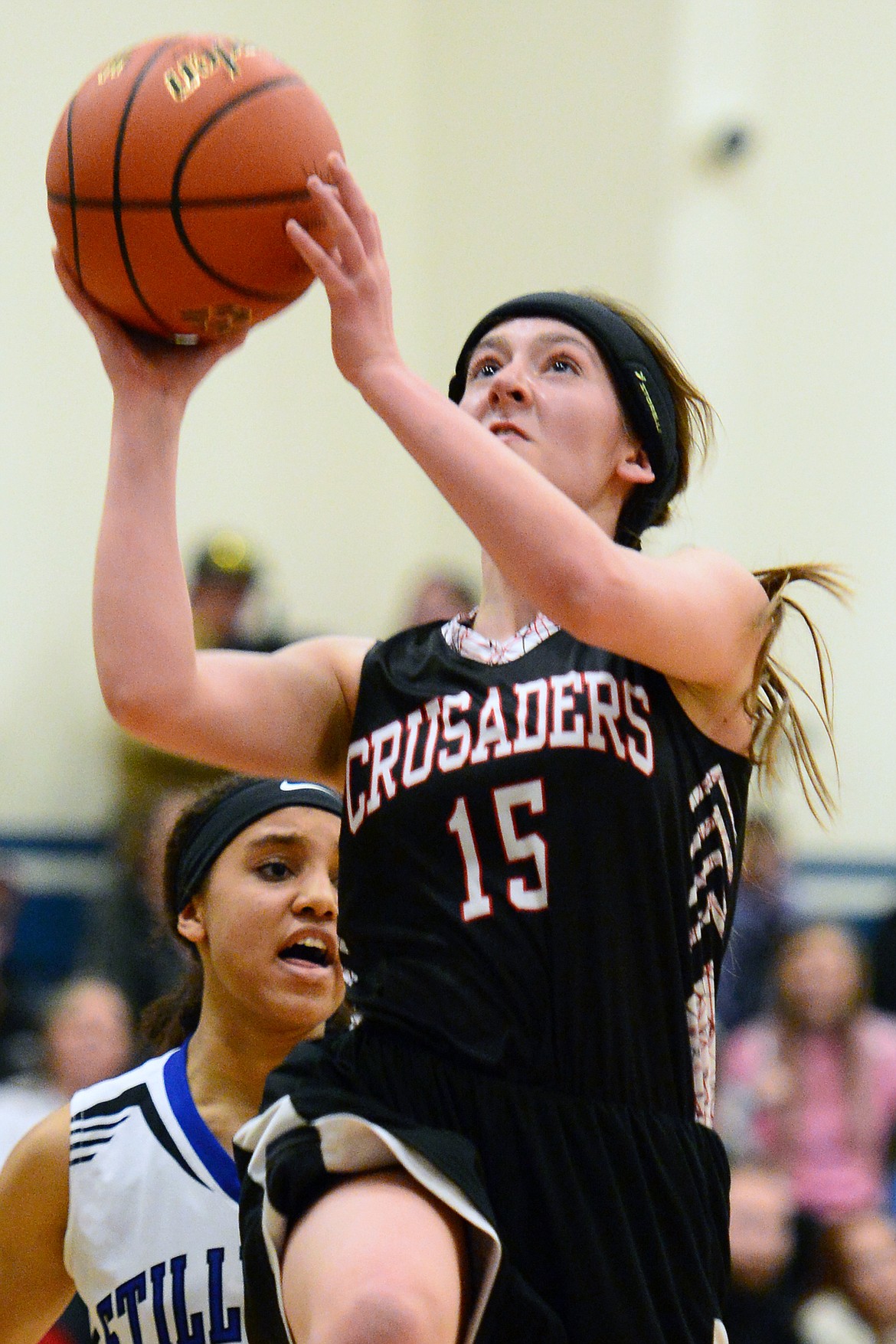 Flathead Valley Homeschool's Elizabeth Buckner (15) drives to the hoop for a layup against Stillwater Christian at Stillwater Christian School on Friday. (Casey Kreider/Daily Inter Lake)