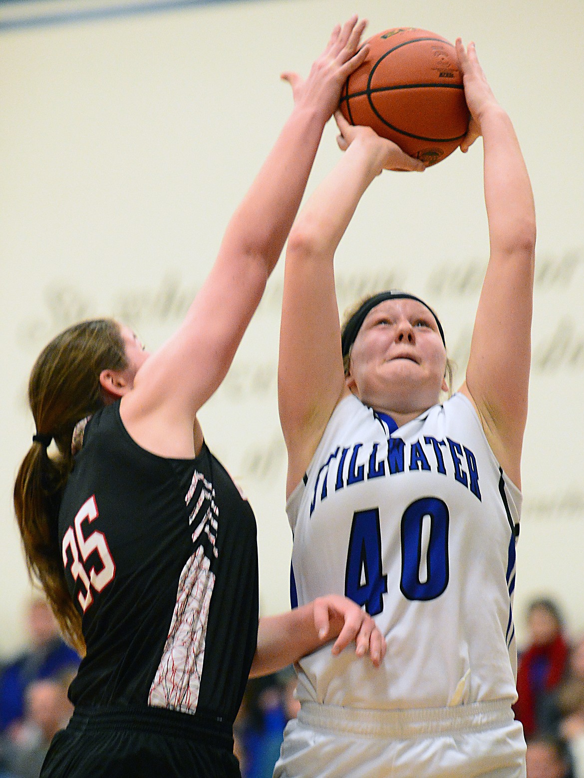 Stillwater Christian's Selah Neumann (40) has her shot deflected by Flathead Valley Homeschool's Makaila Burlingame (35) at Stillwater Christian School on Friday. (Casey Kreider/Daily Inter Lake)