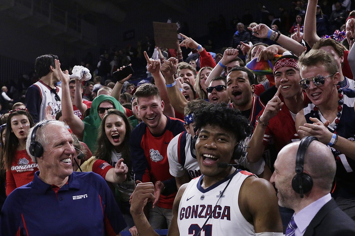 YOUNG KWAK/Associated Press
ESPN announcers Bill Walton, left, and Dave Pasch, right, interview Gonzaga forward Rui Hachimura after Hachimura hit the game-winning shot against Washington last Wednesday in Spokane.