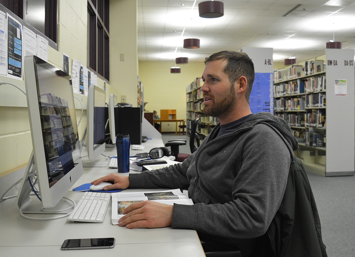 Peter Ziehli, 27, works finish a final paper for his art history course in the campus library in the Student Resource Center at FVCC. //photo by Mary Cloud Taylor