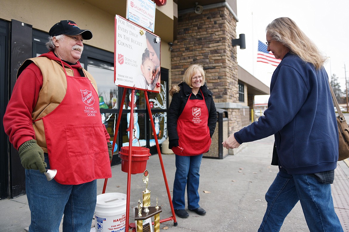 Gary and Luann Mahugh volunteer during the Salvation Army&#146;s annual bell-ringing competition outside Super 1 Foods in Evergreen on Thursday. Columbia Falls won the competition, raising $2,835.59. (Casey Kreider/Daily Inter Lake)