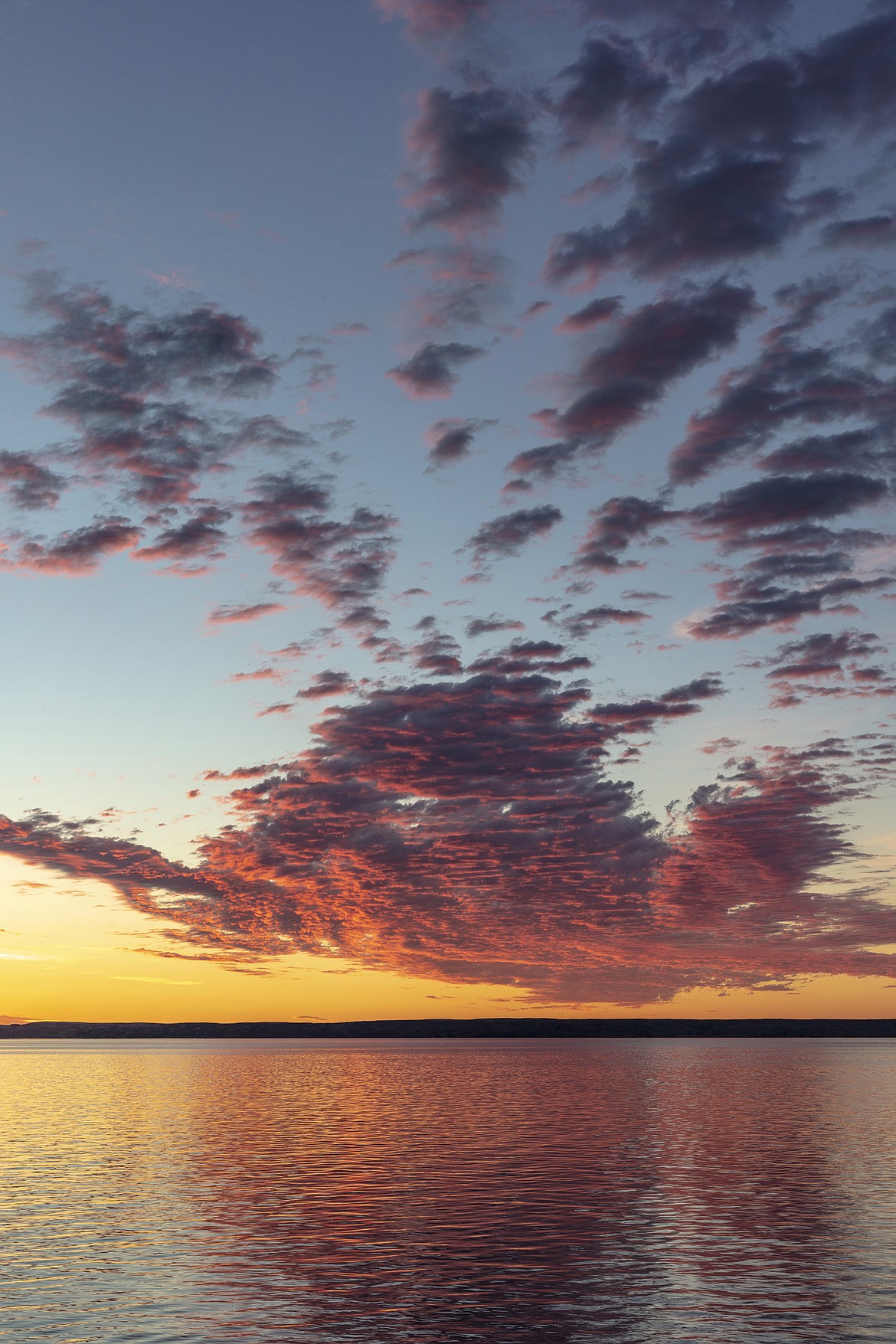 Vivid sunrise clouds over Fort Peck Reservoir in the C.M. Russell National Wildlife Refuge near Fort Peck, Montana. (Chuck Haney Photography)